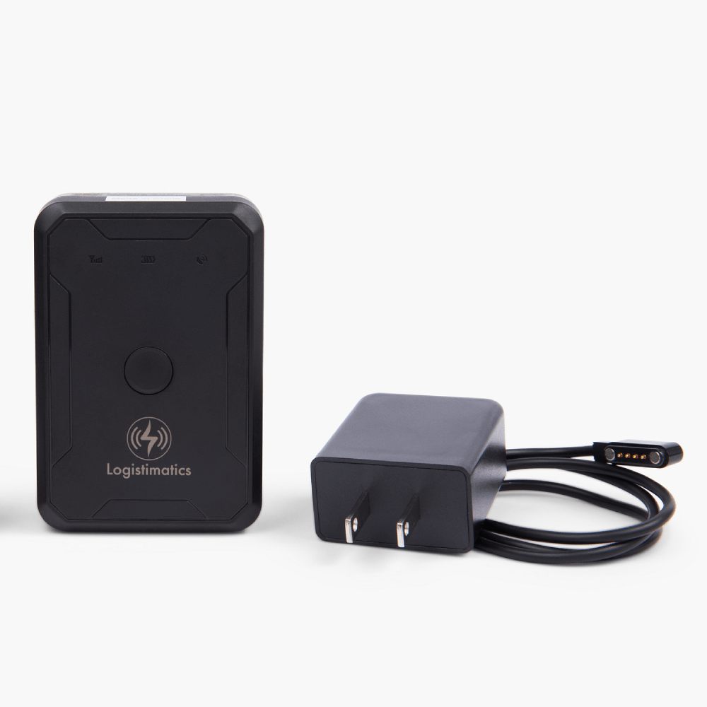 Black GPS tracker and power adapter on a white background