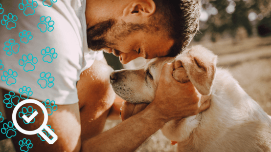 Man happily reunited with his lost dog, symbolizing GPS tracking for pets and peace of mind for pet owners.