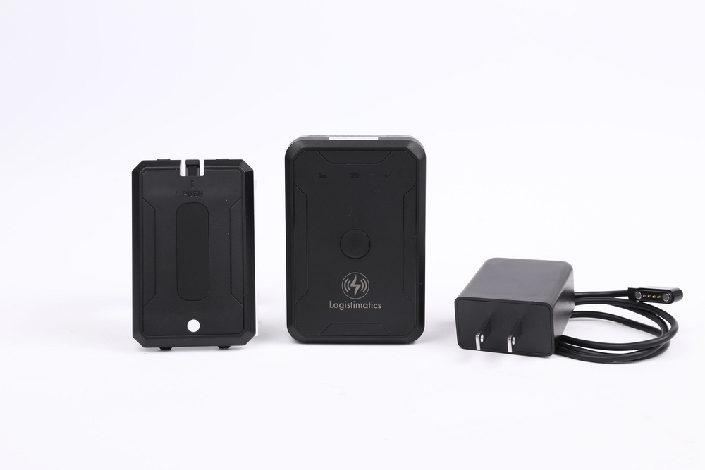 Logistimatics GPS tracker with protective case and charging cable, designed for reliable real-time location tracking.