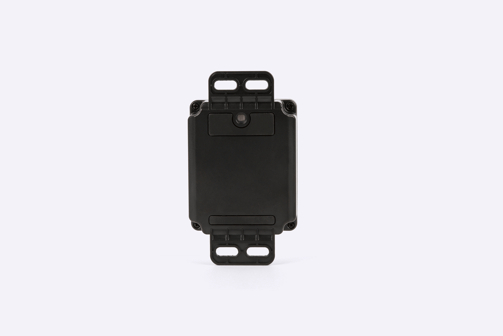 Black GPS tracker on a white background