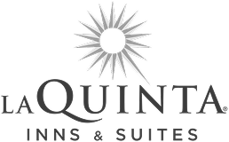 La Quinta Inns & Suites logo with a sun-like symbol above the text.