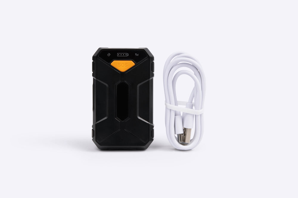 Small gps tracker with a white cable on a white background