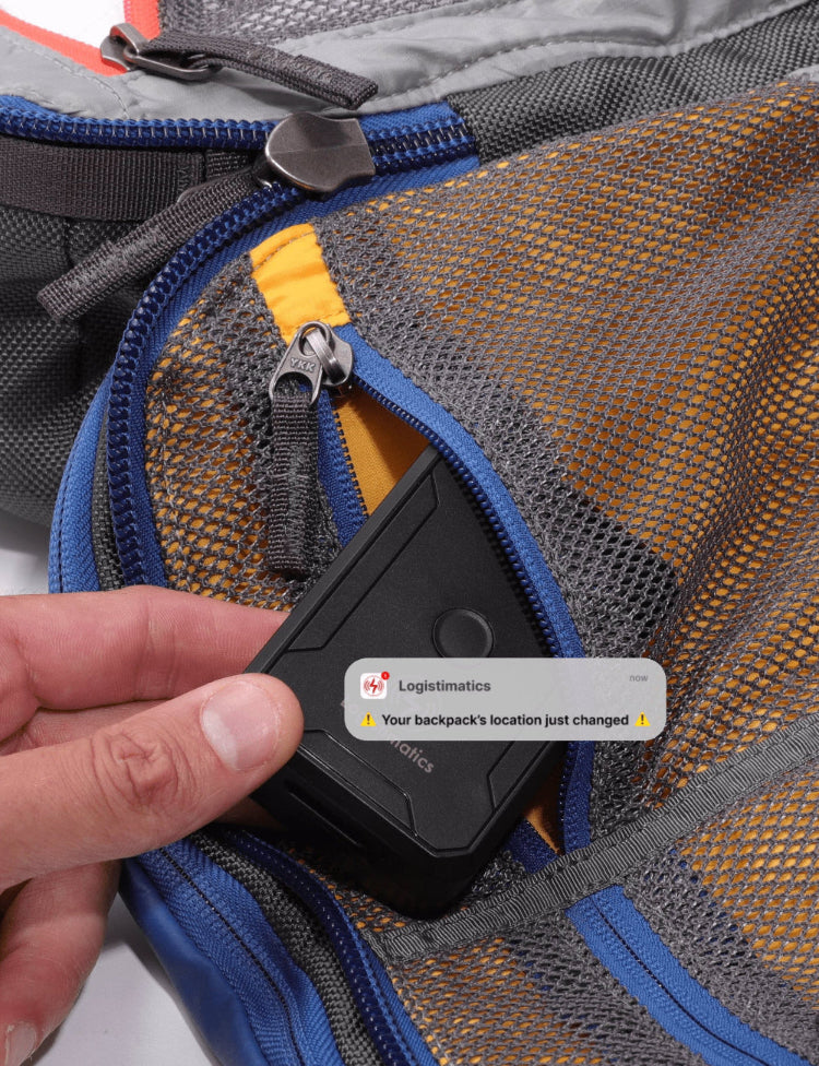 GPS tracker placed inside backpack pocket with real-time mobile alert showing location change notification.