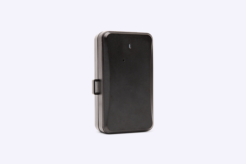 Compact black GPS tracking device with durable casing, shown standing upright on a light background.