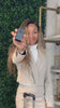 Video featuring a traveler with suitcases at an airport, suggesting a comparison of GPS tracking devices and AirTags for enhancing luggage security and tracking during journeys.