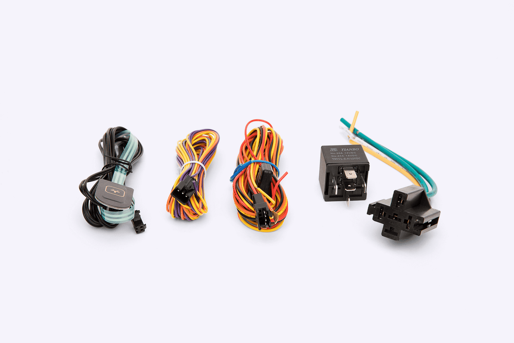 Collection of automotive wiring harnesses and connectors on a white background