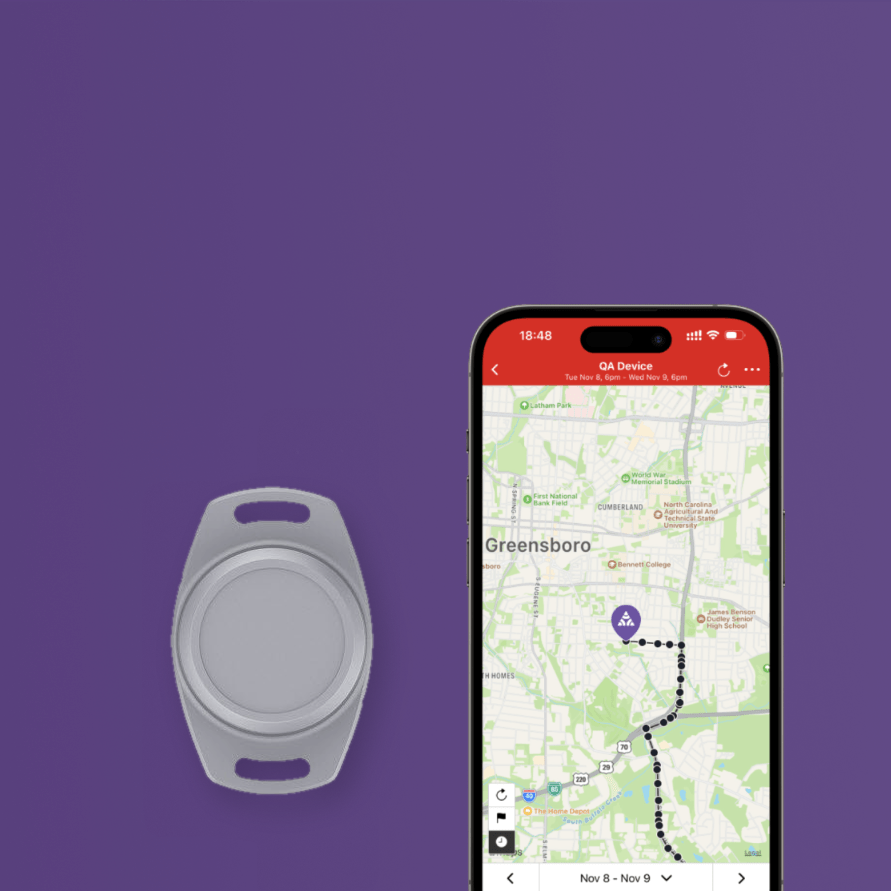 A gray circular tracking device with two small cutouts is shown beside a smartphone displaying a map app labeled 'GA Device' on a solid purple background.